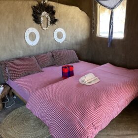 Bed in Osiligilai Maasai Lodge in West Kilimanjaro met Caracal Tours & Safaris, Tanzania